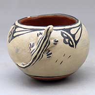 Click for a larger view A small polychrome bowl decorated with a lizard applique and a cloud formation and rain design
by Seferina Ortiz of Cochiti