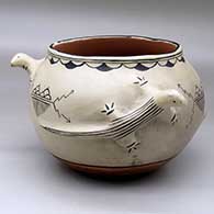 A polychrome jar with a three panel lizard applique and raincloud geometric design
 by Juanita Arquero of Cochiti