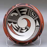 A polychrome bowl decorated inside with a bird-hanging-from-sky-band and geometric design and around the shoulder with a geometric design
 by Marcia Rickey aka Flying Ant of Hopi