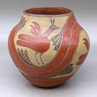 Click for a larger view A polychrome jar decorated with a four-panel roadrunner, rainbow and cloud formation design
by Unknown of Zia