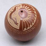 A miniature red seed pot decorated with a sgraffito avanyu, feather, scroll and geometric design
 by Dolly Naranjo-Neikrug of Santa Clara