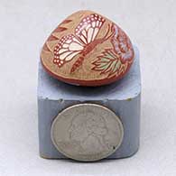 Click for a larger view A miniature seed pot decorated with a sgraffito and painted butterfly, flower and geometric design
by Rosemary Lonewolf of Santa Clara