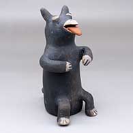 A begging canine figure
 by Marie Laweka of Cochiti