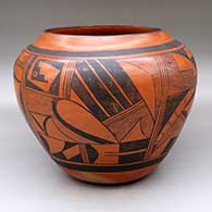 A large black on red jar decorated with a four-panel geometric design
 by Paqua Naha aka 1st Frogwoman of Hopi