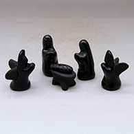 A six piece black on black nativity set
 by Maria Naranjo of Santa Clara
