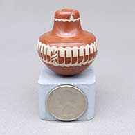 Miniature red-on-red jar with a sgraffito and painted feather ring, kiva step, and geometric design
 by Ursula Curran of Santa Clara