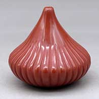 A red melon jar with 32 carved ribs
 by David Baca of Santa Clara