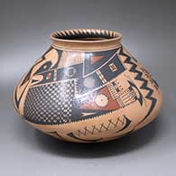 A Ramos polychrome jar with an everted rim and a four-panel geometric design 
 by Gerardo Cota of Mata Ortiz and Casas Grandes