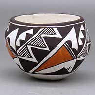 A small polychrome bowl decorated with a four panel kiva step, lightning bolt, rain, cloud formation and geometric design
 by Lucy Lewis of Acoma