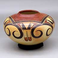 A polychrome jar decorated with a five panel bird element and geometric design
 by Rachel Sahmie of Hopi