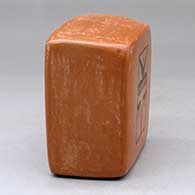 A black on red box decorated on two sides with kachina geometric designs, click or tap to see a larger version