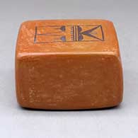 A black on red box decorated on two sides with kachina geometric designs, click or tap to see a larger version