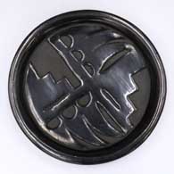 Black plate carved with a geometric design
 by Severa Tafoya of Santa Clara