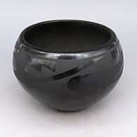 Black bowl with four panel geometric design
 by Tonita Roybal of San Ildefonso