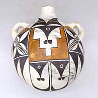 A polychrome canteen with shoulder handles and decorated with a bird element and geometric design
 by Unknown of Acoma