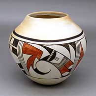 A polychrome jar decorated around the body with a four-panel bird element and geometric design
 by Eunice Navasie of Hopi