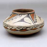 A polychrome low shoulder jar decorated with a geometric design around the shoulder and a four panel kiva step and geometric design above
 by Maria Martinez of San Ildefonso