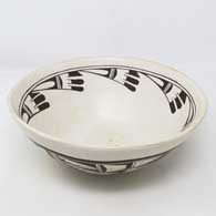 Polychrome bowl with bird element design inside, bird element and geometric design outside
 by Marianne Navasie of Hopi