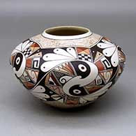 A polychrome bowl decorated with a five panel bird element and geometric design
 by Rainy Naha of Hopi