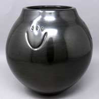 Black jar with 4 bear paw imprints
 by Toni Roller of Santa Clara