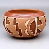 A polychrome Potsuwii-style bowl decorated with a four-panel painted and carved kiva step and geometric design around the body
 by Rosita de Herrera of Ohkay Owingeh