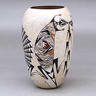 A polychrome vase decorated with a two panel lizard, cornstalk and geometric design
 by Sylvia Naha of Hopi