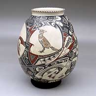 Polychrome jar with a flared opening and a painted coyote, rabbit, bird, and geometric design; includes polished red stand
 by Manuel Rodriguez Guillen of Mata Ortiz and Casas Grandes