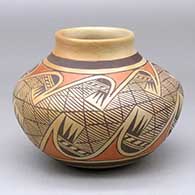 A polychrome jar with a short neck and decorated around the body with a migration pattern design and fire clouds
 by Fannie Nampeyo of Hopi