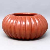 Carved red melon jar
 by Angela Baca of Santa Clara