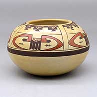 A polychrome bowl decorated with a four panel bird element and geometric design above the shoulder
 by Rachel Sahmie of Hopi
