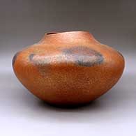 A large orange micaceous jar with an organic opening and fire clouds, click or tap to see a larger version