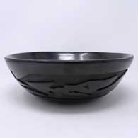 Black bowl carved with an avanyu design
 by Christina Naranjo of Santa Clara