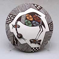 A polychrome seed pot decorated with appliques and a cloudeater, fish, fineline and geometric design
 by Carolyn Concho of Acoma