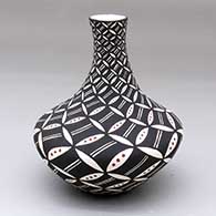 A polychrome tall neck jar decorated with a North Star snowflake and geometric design
 by Sandra Victorino of Acoma