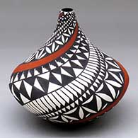 A polychrome tear drop jar decorated with a spiral geometric design
 by Sandra Victorino of Acoma