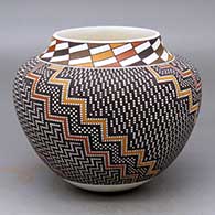 A polychrome jar with a raised rim and decorated with a tiny square and geometric design
 by Frederica Antonio of Acoma