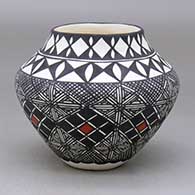 A polychrome jar decorated with a fineline and geometric design
 by Sandra Victorino of Acoma
