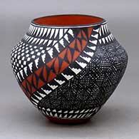 A polychrome jar decorated with a two-panel checkerboard, fineline and geometric design
 by Sandra Victorino of Acoma