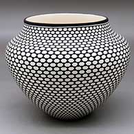 A black on white jar decorated with a geometric design
 by Paula Estevan of Acoma