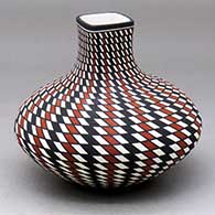 Click for a larger view A polychrome jar with a square neck and decorated with a spiral checkerboard geometric design
by Paula Estevan of Acoma