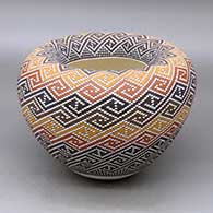 A polychrome jar with an Infinity rim and decorated with a geometric design built of tiny squares
 by Frederica Antonio of Acoma