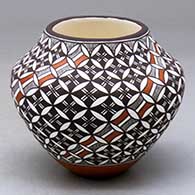 A polychrome jar decorated with a yucca leaf snowflake, fineline and geometric design
 by Amanda Lucario of Acoma