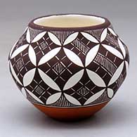 A small polychrome jar decorated with a yucca leaf snowflake, fineline and geometric design
 by Amanda Lucario of Acoma