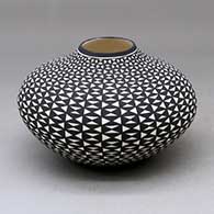 Click for a larger view A black on white jar with a raised rim and decorated with an hourglass geometric design
by Paula Estevan of Acoma