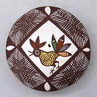 A miniature polychrome seed pot decorated with a rooster, fineline and geometric design
 by Diane Lewis of Acoma