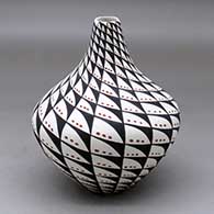 A polychrome tear drop jar decorated with a spiral mesa, snowflake and geometric design
 by Sandra Victorino of Acoma