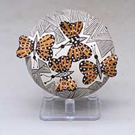 Click for a larger view A polychrome seed pot decorated with butterfly wing appliques and a butterfly, fineline and geometric design
by Alisha Sanchez of Acoma
