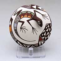 Click for a larger view A polychrome seed pot decorated with lizard head and tail appliques and a geometric design
by Carolyn Concho of Acoma