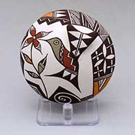 A polychrome seed pot decorated with hummingbird wing and lady bug appliques and a hummingbird, flower, spiral and geometric design
 by Carolyn Concho of Acoma