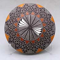 A polychrome seed pot decorated above the shoulder with a fineline and geometric design
 by Amanda Lucario of Acoma